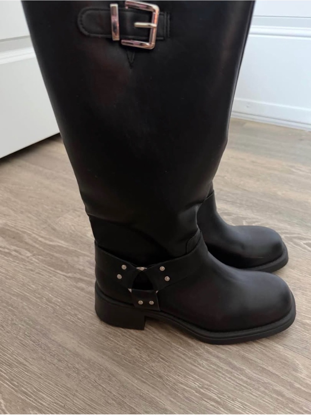 Black knee high leather moto boots